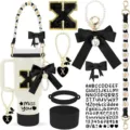 Tumbler accessory set with black bow, daisy strap, silicone boot, and letter charms. - Letter X