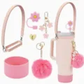 Pink tumbler accessory set with silicone boot, strap, flower straw cover and plush pom pom. - Pink