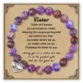 Close-up detail of the purple impression jasper bead bracelet with a sister heart charm card. - Engraved (Sister Card) / Emperor Stone