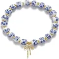 Ceramic blue and white porcelain beaded bracelet with gold bow pendant and rhinestone details. - Blue Porcelain Style 1