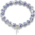 Blue and white porcelain style ceramic beaded bracelet with cute metal bow pendant details. - Blue Porcelain Style 2