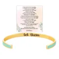 Detailed view of gold stainless steel cuff bracelet with mint green enamel and engraving. - Green Gold & Black Gold - Let Them
