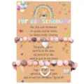 Detail view of the pink beaded mother-daughter bracelet set with heart charms on card. - Woven Style / Heart 2-Piece Set-1