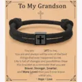 Detailed view of handmade black braided Milan rope bracelet featuring stainless steel cross charm. - Grandson - 14