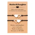 Detail view of interlocking heart stainless steel braided bracelets on Mother Daughter card. - 2-Piece Heart Set - 2 / Silver