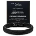 Detailed view of braided leather bracelet with magnetic clasp and message card for godson. - Stainless Steel Accessories / To My Godson