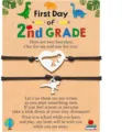 Dinosaur matching bracelets detail view, stainless steel dinosaur charm and adjustable black cord. - 2nd Grade-16