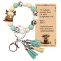 Porte-clés bracelet en perles de silicone avec pendentif vache des Highlands et joli pompon. - Vache Highland Verte