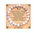 Detailed view of the beaded bracelet with engraved heart charm and heartwarming message card. - Pink Zebra Jasper with Nana Card