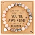 Detail shot of natural stone beaded bracelet with heart charm on inspirational kraft card. - Pink Zebra Jasper with AWESOME Card