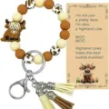 Porte-clés bracelet en perles de silicone vache Highland avec pompons et pendentif. - Ensemble Carte Vache Brune