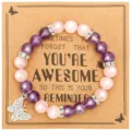 Detail shot of beaded gemstone bracelet with butterfly charm and inspirational message card. - Rose Quartz & Amethyst with AWESOME Card