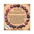 Detailed view of handmade gemstone beaded bracelet with heart pendant for grandma gift. - Black Cord Rhodochrosite with Grandma Card