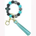 Porte-clés en perles de silicone noir et turquoise avec imprimé léopard, croix et pompon. - Jésus Bleu Tiffany