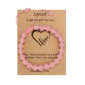 Pink crystal bead bracelet detail view with gift card and handmade adjustable cord design. - Rose Quartz