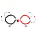 Detail shot of couple magnetic stone bracelets with heart pendants for custom logo engraving. - Couple Bracelets