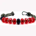 Detail shot of handmade paracord keychain with red and black acrylic crystal beads. - Style 3
