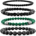 Detailed view of a four-piece beaded bracelet set featuring black stone, wood, and malachite. - Matte Black Stone & Malachite Bracelet