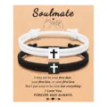 Black and white braided rope couple bracelets with cross metal charms on display. - Couple Cross Woven Bracelet Set (Soulmate) / Black and White