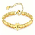 Detail view of a gold-plated beaded bracelet with a number 16 heart charm and adjustable chain. - Gold Customizable Age - 22