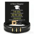 Detail view of men's braided leather bracelet with stainless steel clasp and graduation card design. - 19cm / Class of 2026