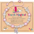 Handmade pink beaded unicorn charm bracelet for kids with crystal rhinestones on display card. - You're - 2