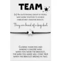 Detailed view of a silver star wish bracelet on a black cord with card packaging. - 1 Card Pack (TEAM)