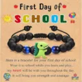 Children black beaded bracelet with cute green dinosaur charm and blue cat eye beads detail - First Day of School Dinosaur