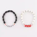 Stackable clay bead bracelets set with teach letter and cute red apple charms for women. - 24-Piece Apple Teacher's Day Set 1 (12 Pieces per Style)