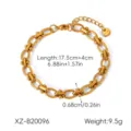 Detail view of stainless steel link bracelet showing precise length and width measurements. - Gold