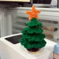 Handmade crochet Christmas tree yarn knitted holiday table ornament detail view display item - Christmas Tree