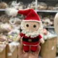 Handcrafted crochet Santa Claus doll detail view, cute knitted wool holiday ornament. - Santa Claus