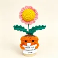 Handmade crochet potted sunflower with cute face holding sign for wonderful gift choice. - Seal Sunflower Potted Plant