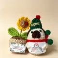 Handmade crochet Christmas penguin and sunflower potted plant detail view, festive plush toy. - Christmas Pochacco Gift Box 2