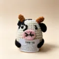 Handmade crochet cow plush toy holding thank you card, cute emotional support animal. - Cow
