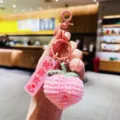 Rosa gehaekelter Pfirsich Schlüsselanhänger süsse handgemachte Tasche Deko für Damen und Mädchen - Knopf-Stil - Pfirsich (Freude)