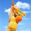 Handcrafted crochet fruit keychain cute knitted pear and orange bag charm pendant accessory - Buckle Style / Orange and Pear