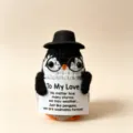 Handmade crochet penguin doll with hat and glasses, cute knitted animal toy variant. - Christmas Penguin 1