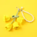 Handmade crochet lily of the valley pearl keychain detail view, cute bag charm pendant. - Yellow