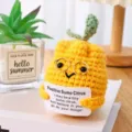 Close-up of cute handmade crochet citrus plush doll with glasses and card for lovely decor. - Ugly Orange with Gold Glasses