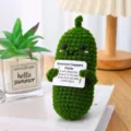 Handmade crochet emotional support pickle doll holding an encouraging sign, cute desk decor. - Funny Cucumber with Colorful Sign
