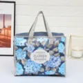 Bolsa de almacenamiento plegable de tela no tejida con diseño floral azul y asas. - Hortensia gris / 30x23x14cm
