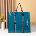 Bolso de compras grande tejido y laminado, bolsa reutilizable impermeable con asas resistentes. - Verde azulado