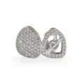 Hip hop grillz detail shot featuring double tooth design with cubic zirconia and heart arrow. - Silver