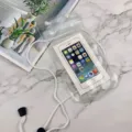 Clear waterproof phone pouch detail shot, touch-screen friendly design for underwater use. - White