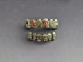 Poker teeth grillz with sparkling rhinestones, detailed close-up shot of hip hop rapper jewelry. - Tropical Print Top And Pants