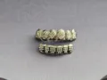 Close-up detail of hip hop grillz with sparkling rhinestones and poker suit symbols. - Black Set
