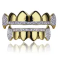 Detail view of gold plated hip hop grillz with clear zircon stones and vampire fangs design. - Gold Full Set