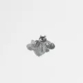 Detailed shot of a silver bee design hip-hop single tooth grillz with sparkling zircons. - Silver