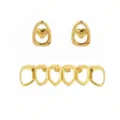 Gold hip hop grillz detail shot, featuring a six tooth grill and two heart shaped charms. - Gold Heart Set